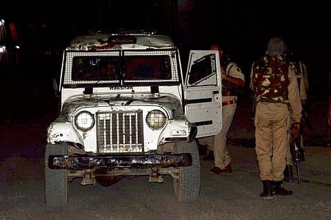Security person stand guard after militants opened fire on the Amarnath Yatra in which some pilgrims were killed in Anantnag in Jammu and Kashmir on Monday. | PTI