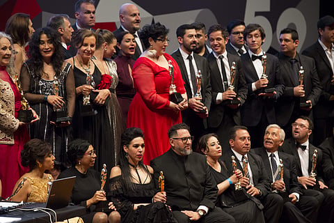 The Ariel winners pose with their awards following the 59th Ariel Awards at the Palace of Fine Arts in Mexico City on July 11. The Ariel Awards recognize excellence in motion picture making in Mexican cinema.| AP