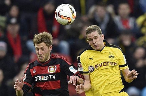 Bayer Leverkusen says Sven Bender (R) will sign a contract through June 2021 after undergoing a medical examination. (File | AP)