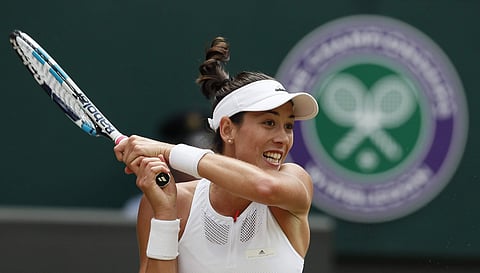 Spain's Garbine Muguruza returns to Slovakia's Magdalena Rybarikova, during their Women's Singles semifinal match on day nine at the Wimbledon Tennis Championships in London Thursday, July 13, 2017. | AP