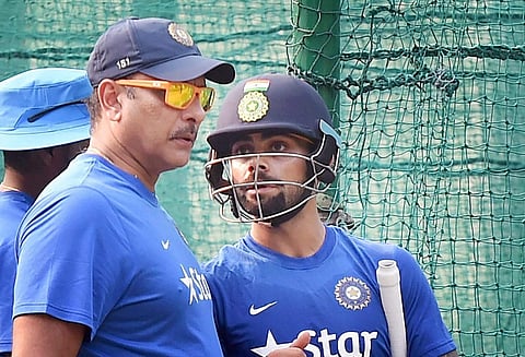 File photo of Team India coach Ravi Shastri with skipper Virat Kohli at a training session in Mohali. (File photo | PTI)