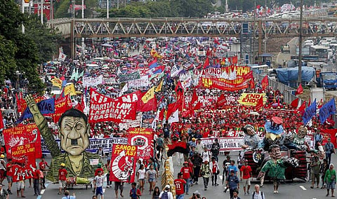 'Do not try to scare me with prison or the International Court of Justice. I'm willing to go to prison for the rest of my life.' Philippine President Rodrigo Duterte on Monday marked his annual state of the nation address with this statement. Outside, thousands of protesters marched with Duterte's effigy, demanding that he deliver on promises he made in his first state of the nation speech last year. (Photo | AP)