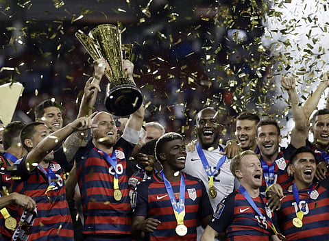 United States players celebrate after beating Jamaica 2-1 in the Gold Cup final soccer match in Santa Clara. | AP