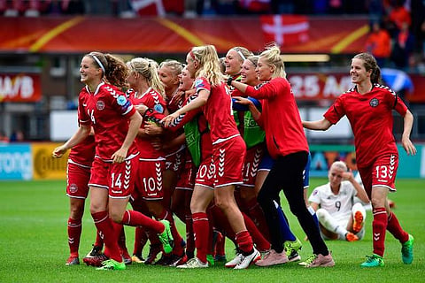 Denmark's players react after winning the quarter-final UEFA Women's Euro 2017 football match against Germany. | AFP