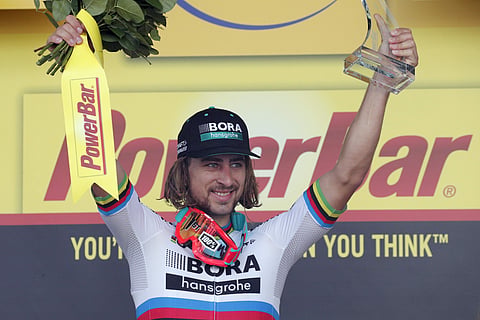 Stage winner Peter Sagan of Slovakia celebrates on the podium after the third stage of the Tour de France cycling race.  | AP