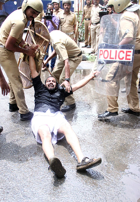 Police removing Youth Congress activists after they staged a march to the City Police Commissioner’s office against the government’s educational policy, in Kochi on Saturday.  (EPS | Melton Antony)
