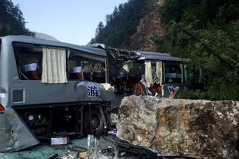 12 people were killed when a 6.5-magnitude earthquake struck southwestern China on Tuesday. A tour bus damaged during an earthquake is seen in Jiuzhaigou. ( Photo | AFP )