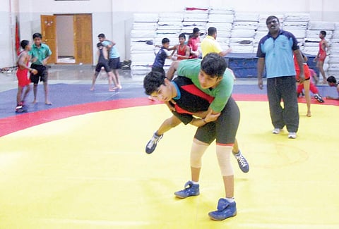 Prema Huchchannavar (L) and Shaheeda Begam Baligar during a practice session with coach Sharanagouda Beleri