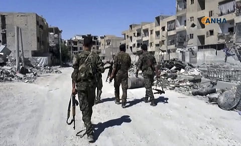 A US-backed Kurdish-Arab alliance meanwhile is battling to retake the provincial capital, Raqa city, from IS. (AP)
