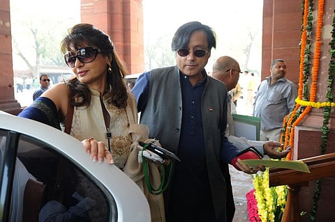 Congress Party's Member of Parliament Shashi Tharoor (R) with his wife Sunanda Pushkar. |File Photo: AFP