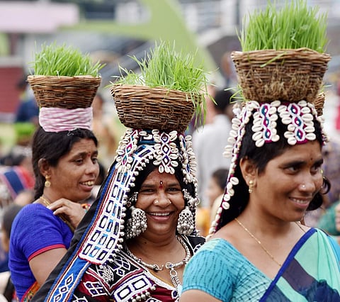 Women from Lambada tribe celebrate Teej festival at Tank bund, in Hyderabad.Teej, the celebration of fertility, is observed by maidens of Lambada community, at the beginning of the monsoons, or with the advent of the Shravana month.  (EPS | Satish Babu)