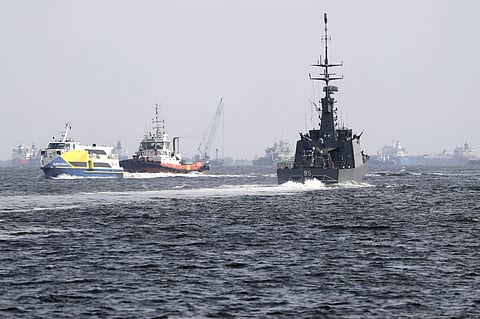 FILE - In this Monday, Aug. 21, 2017, photo provided by the U.S. Navy, tugboats from Singapore assist the Guided-missile destroyer USS John S. McCain | AP