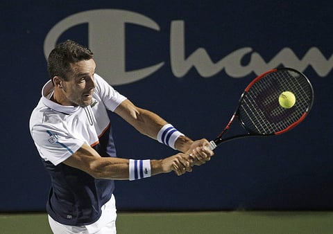Roberto Bautista Agut, of Spain, returns a shot against Jan-Lennard Struff, of Germany, during a semifinal of the Winston-Salem Open tennis tournament. | AP