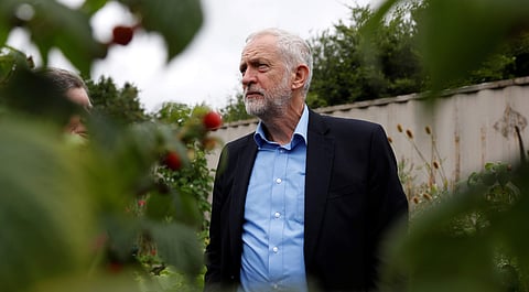 Britain's opposition Labour Party leader Jeremy Corbyn stands in the garden at the Olive Tree Cafe in Swindon. (Photo | Reuters)