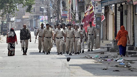 Policemen march amidst curfew in Sirsa on Saturday. | File photo by PTI