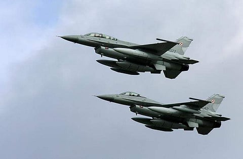 Two of the first four Polish Air Force F-16 fighter jets arrive at the Krzesiny airport in western Poland, near the city of Poznan. (Photo | Reuters)