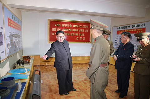 FILE - In this undated photo distributed Wednesday, Aug. 23, 2017, by the North Korean government, leader Kim Jong Un, left, visits the Chemical Material Institute of Academy of Defense Science at an undisclosed location in North Korea. | AP