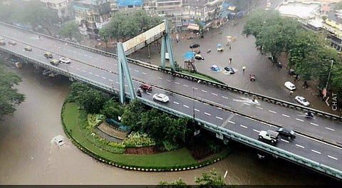 Heavy rains today lashed Mumbai and adjoining Navi Mumbai and Thane regions, delaying suburban train services and leaving vehicles crawling through waterlogged roads in low-lying areas. In image: Khodadad circle.