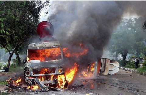 Media vans torched by angry Dera Sacha Sauda followers, following Dera chief Gurmeet Ram Rahim Singh being convicted for rape. (Photo | PTI)