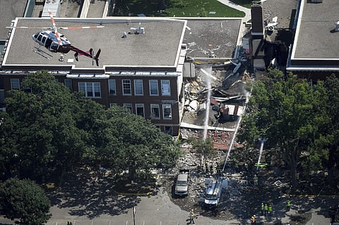 Emergency workers respond to an explosion at Minnehaha Academy in Minneapolis (AP)