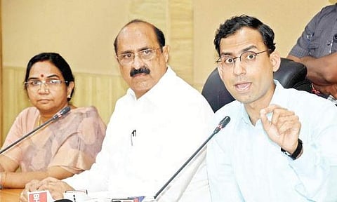 AMTZ CEO Jitendra Sharma speaking to the media at NTRUHS in Vijayawada  on Tuesday. Health Minister Kamineni Srinvas is also seen | Express