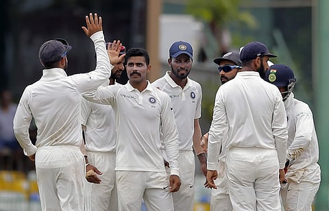 India's Ravindra Jadeja, center without cap, celebrates with teammates the dismissal of Sri Lanka's Dhananjaya de Silva during the fourth day's play of their second cricket test match in Colombo, Sri Lanka, Sunday, Aug. 6, 2017. (AP Photo/Eranga Jayawarde