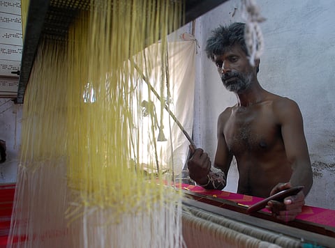 A weaver at work. (File photo | EPS)