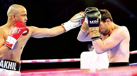 Akhil Kumar in action against Australia’s Ty Gilchrist in Mumbai