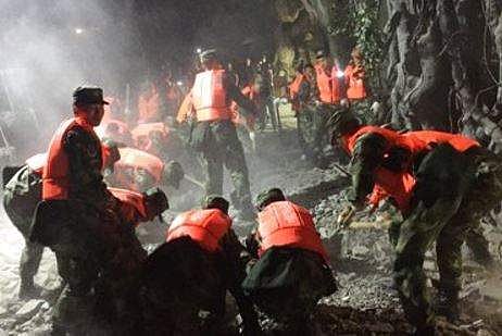 In this photo released by China's Xinhua News Agency, rescuers work at a tourist site in Zhangzha in Jiuzhaigou county in southwestern China's Sichuan province, Wednesday, Aug. 9, 2017. | AP