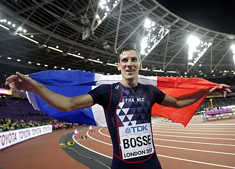 France's Pierre-Ambroise Bosse celebrates after winning the gold medal in the men's 800-meter final during the World Athletics Championships  (AP)