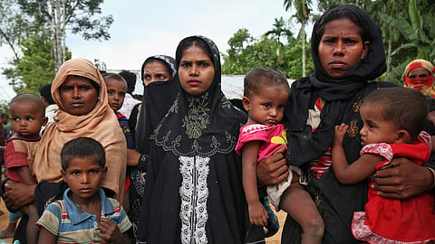Members of Myanmar's Muslim Rohingya ethnic minority wait to enter the Kutupalong makeshift refugee camp in Cox's Bazar, Bangladesh, Monday, Aug. 28, 2017. 