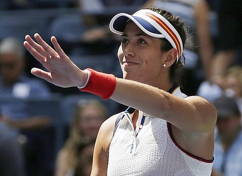 Garbine Muguruza, of Spain, waves to spectators after defeating Varvara Lepchenko, of the United States, during the first round of the U.S. Open tennis tournament, Monday, Aug. 28, 2017, in New York. | AP