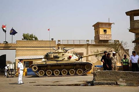 Egyptian security forces stand guard outside one of the entrances of Tora prison, in Cairo, Egypt.|AP
