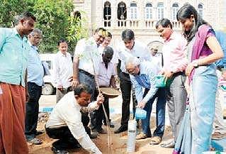Bureaucrat K Satyagopal demonstrating the rootzone irrigation technique he developed