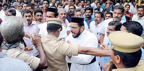 Police attempting to disperse the followers of Jacobite and Orthodox Church factions after the Catholicos was locked up  in St Mary’s Church at Varikoli, Puthencruz, on Sunday