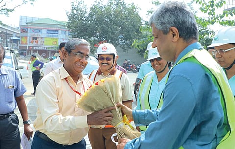 KMRL managing director Elias George welcoming Commissioner of Metro Rail Safety  K M Manoharan in Kochi on Monday |  Express