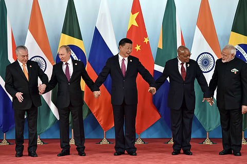 From left, Brazil's President Michel Temer, Russian President Vladimir Putin, Chinese President Xi Jinping, South Africa's President Jacob Zuma and Indian Prime Minister Narendra Modi pose for a group photo during the BRICS Summit at the Xiamen Internatio