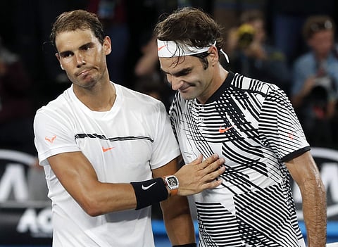 In this Jan. 29, 2017, file photo, Switzerland's Roger Federer, right, is congratulated by Spain's Rafael Nadal after winning the men's singles final at the Australian Open tennis championships. | AP