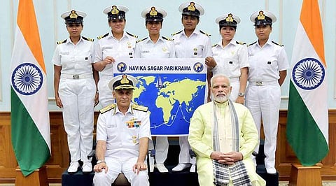 Prime Minister, Narendra Modi with the six women officers of the Indian Navy who are circumnavigating the globe on the sailing vessel INSV Tarini. Chief of Naval Staff, Admiral Sunil Lanba is also seen. (PTI Photo)