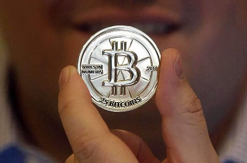 25 Bitcoin token  (File | Associated Press)