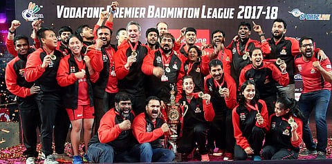 Hyderabad Hunters team members pose for photograph along with Team Championship Trophy after winning the Vodafone Premier Badminton League. (Photo | PTI)