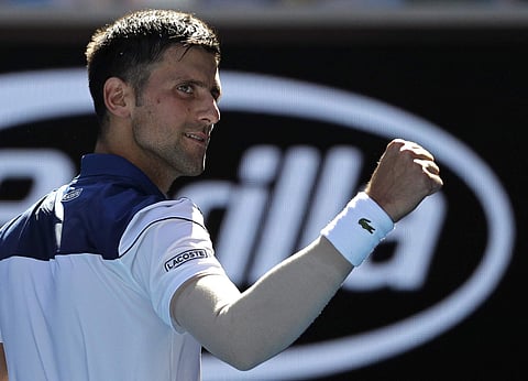 Serbia's Novak Djokovic celebrates after defeating United States' Donald Young | AP