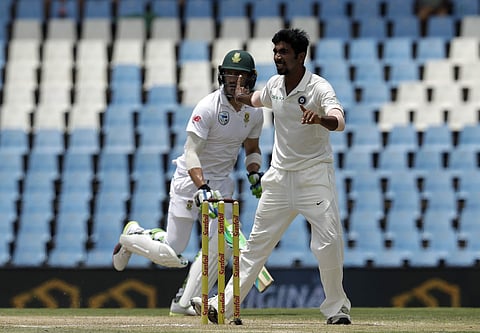 India's bowler Jasprit Bumrah, right, reacts as South Africa's captain Faf du Plessis‚ makes a run on the fourth day of the second cricket Test match between South Africa and India at Centurion Park. | AP