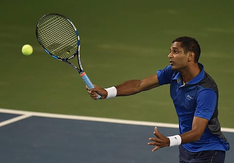 Tennis player Ramkumar Ramanathan India plays a shot during a match during Maharashtra Open 2018 in Pune on Monday. | PTI