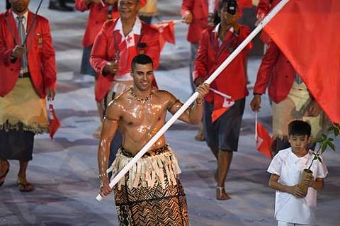 Tonga's flagbearer Pita Nikolas Taufatofua leads his delegation during the opening ceremony of the Rio 2016 Olympic Games  | Photo: AFP