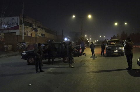 Policemen block the main road near the Intercontinental Hotel after a deadly attack in Kabul, Afghanistan, Saturday, Jan. 20, 2018.  | AP