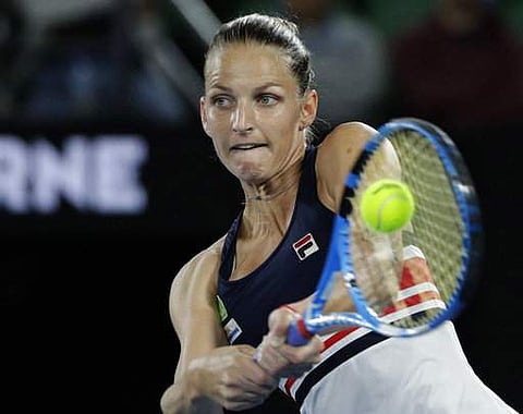 Karolina Pliskova of the Czech Republic hits a backhand return to compatriot Barbora Strycova during their fourth round match at the Australian Open tennis championships in Melbourne. | AP