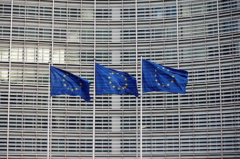 European Union flags flutter outside the EU Commission headquarters in Brussels, Belgium