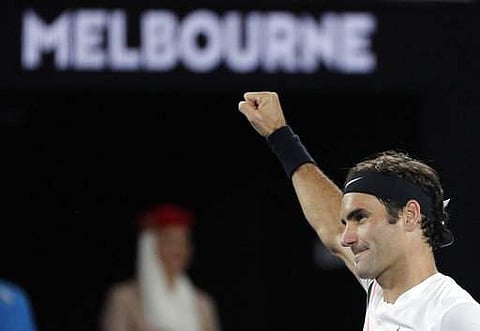 Switzerland's Roger Federer celebrates after defeating Tomas Berdych of the Czech Republic in their quarterfinal at the Australian Open tennis championships. | AP