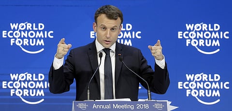Emmanuel Macron, President of France, gestures during a special address as part of the annual meeting of the World Economic Forum in Davos, Switzerland, Wednesday, Jan. 24, 2018. (AP Photo)